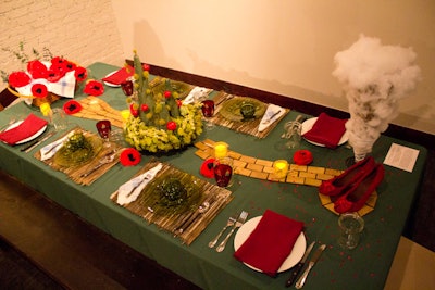 Taken by the idea of journeys, Anita Erickson and Fallon Barr of Red Chair Market followed the yellow brick road with their ode to The Wizard of Oz. The duo conceived a tableau that combined a miniature tornado with straw mats, a basketful red poppies, and the iconic ruby slippers.