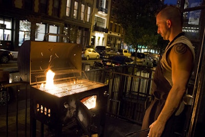 Forgione set up a charcoal grill outside his TriBeCa restaurant to prepare the vegetables for the meal.
