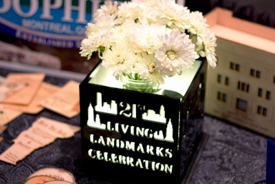 Surface Grooves debuted a new custom-fabricated, laser-cut centerpiece for the 21st Living Landmarks Celebration, which takes place November 6 at the Plaza. The lighted decor item features a reusable base and removable panels that can be switched out for each event.