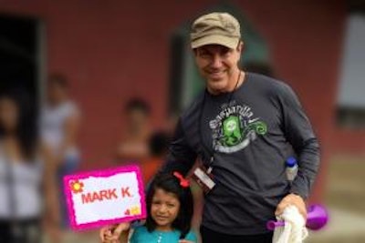 Marvelless Mark in Ecuador with Ashly Atati, the child he sponsors through Compassion International.