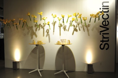 Yellow calla lilies in dangling vases, along with display pedestals showcasing the beauty cream, dotted the venue, which was designed by Patrick J. Clayton Productions.