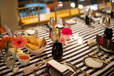 Opulent table settings for the Operanation V.I.P. dinner mixed modern Spanish elements with references to the early '90s.