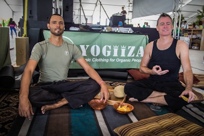 After the Sacred Space Yoga class on Saturday's Festival Day, yogis learned about organic clothing at the Yogiiza booth.