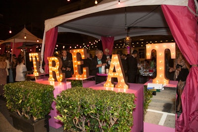 After the concert, a party took place along Grove Street. The alfresco bash was filled with cabanas holding snacks, drinks, and candy jars, and it was open to all 2,700 guests who attended the concert. 'So even guests that did not purchase a pre-concert dinner packages are partaking in an elevated experience where everyone is a V.I.P.,' said planner Katie Nicely.