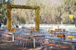 A series of 10 wooden arches, each 12 by 12 feet, created oversize gateways that ran down the center of the 850-foot-long picnic area.
