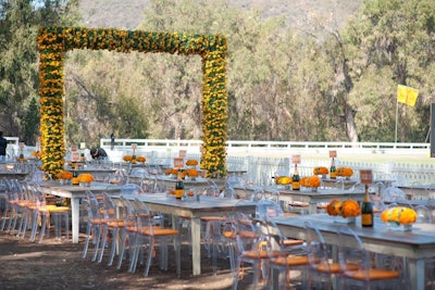 A series of 10 wooden arches, each 12 by 12 feet, created oversize gateways that ran down the center of the 850-foot-long picnic area.