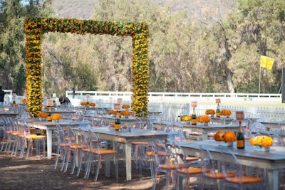 Monochrome marigolds and table numbers in champagne bottles sat atop rustic tables at the Veuve Clicquot Polo Classic, designed by BrownHot Events, in Los Angeles earlier this month.