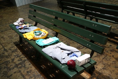 The decor in the City Break area included park benches on which clothing and accessories were displayed.