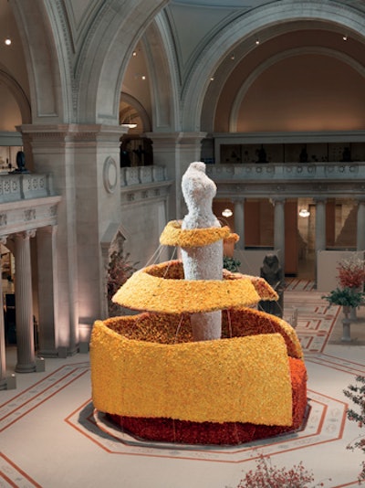 A 30-foot rose-covered sculpture representing Charles James's famous curve-loving construction stood above the Great Hall's information desk for the 2014 gala, which celebrated the 20th-century American couturier.