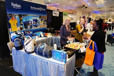 On the expo floor, attendees chatted with vendors, including Scarborough & Tweed.