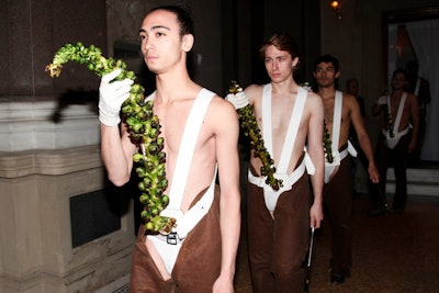Men in backless chaps walked around the room holding large Brussels sprout stalks and knives; guests were asked to cut the sprouts onto their plates.