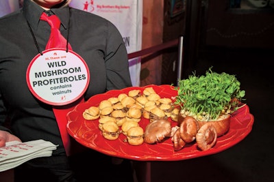 Servers from the Catered Affair wore appetizer badges with food allergy information, in case guests couldn't hear over the band performances, at the Big Brothers Big Sisters of Massachusetts Bay's “Big Night” event at House of Blues Boston in February 2013.