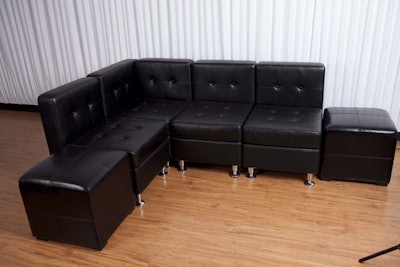 Black sectional with foot stools
