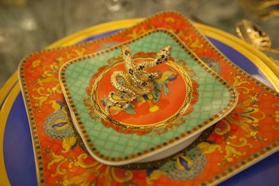 Slithery snake napkin rings served as the focal point of Circa Lighting’s vibrant place setting.