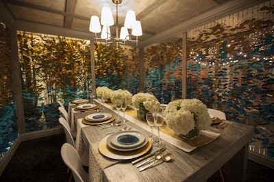 Harrington College of Design showcased garland walls made of discs in shades of teal, turquoise, and gold. The table display, which was designed by the school’s students, also included agate coasters and gold flatware.