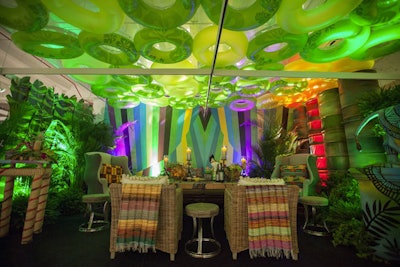 Inner tubes suspended from the ceiling were one of many playful touches at the tropical cabana created by Kehoe Designs.