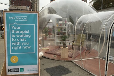 Signage outside the domes invited passersby to step inside to try the app.