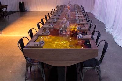 For the 15-minute tasting experience, guests sat at one of two 25-foot tables made of walnut and black glass.