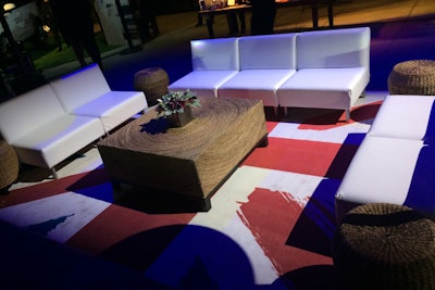 A Union Jack rug added a pop of color under a white seating group at the Land Rover event.