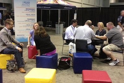 In one of the “Splash Talk” lounges, organizers provided colorful seating cubes that guests could configure as needed to meet with one another.