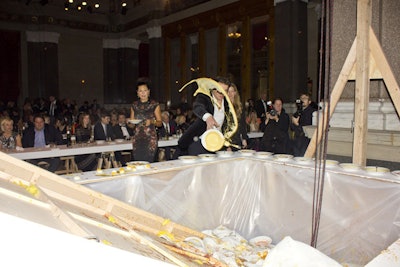 After the soup course, the rack of suspended chickens was dropped, crashing into the hors d'oeuvres presentation table underneath. Guests were then encouraged to throw their bowls into the pit of rubber chicken carnage.
