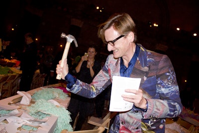 Guests, including fashion journalist Hamish Bowles, attacked the dinner tables with hammers during the dessert performance. The tables were stocked with Vosges chocolates, cotton candy, and cookies.