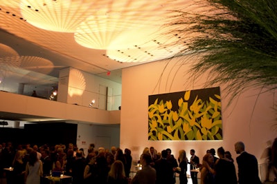 The cocktail area featured a large wooden bar, along with highboy tables.