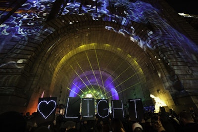 At the festival, lighting designer Howard Ungerleider's high-powered laser show filled the archway under the Manhattan Bridge, creating a rave-like mix of music, smoke, and colored light.
