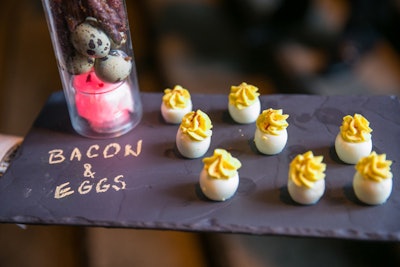 Passed hors d'oeuvres, like deviled eggs, were served on slate boards with item names written in chalk for an event at the Breakers Mediterranean Courtyard during the Palm Beach Food & Wine Festival in December 2013.