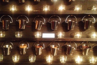 Buckets of cobbler hung from a wooden wall at a Honeywell event in San Diego.