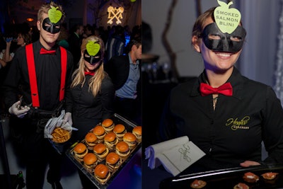 At The Knot's “Knot-so-Typical Industry Event” at Miami's Studio 743 in January 2013, servers from Hugh's Catering wore apple-shaped food signage on their foreheads and were encouraged not to speak during the surrealist-theme party.