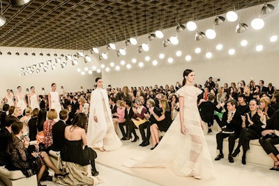The evening's main attraction was a 'Sala Bianca' fashion show of all-white haute couture looks designed exclusively for and in homage to New York and the new Fifth Avenue flagship. The show took place in the Emily Fisher Landau Gallery, juxtaposed against the iconic suspended concrete grid ceiling designed by Marcel Breuer.