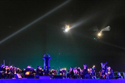 As guests watched, three helicopters buzzed in circles above the orchestra. 'Some romantic songs were played to counterbalance the dance/stuntmen/helicopter performance,' said de Betak.