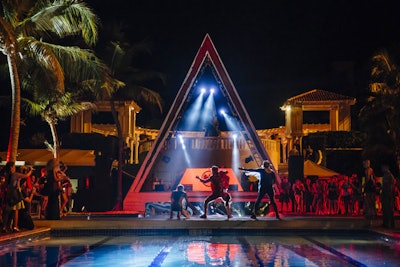 On October 30, the first night guests arrived, a welcome party at the resort's north pool featured rotating DJs as well as dance troupes and performances. A row of Bacardi bars lined the pool while the DJs spun from specially erected, triangle-shaped booths.
