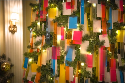 The architecture firm's tree was hung with 1,000 rectangles of laser-cut acrylic in hot pink, cyan, orange, yellow, and white.