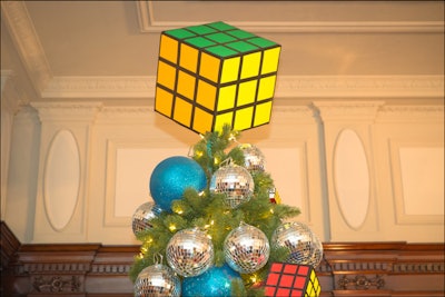 Craig Grudz of event design company Designing Trendz created a decorative tree scheme inspired by the 1980s. Appropriately, his tree was crowned with an oversize Rubik's Cube, and mini disco balls decked the branches.
