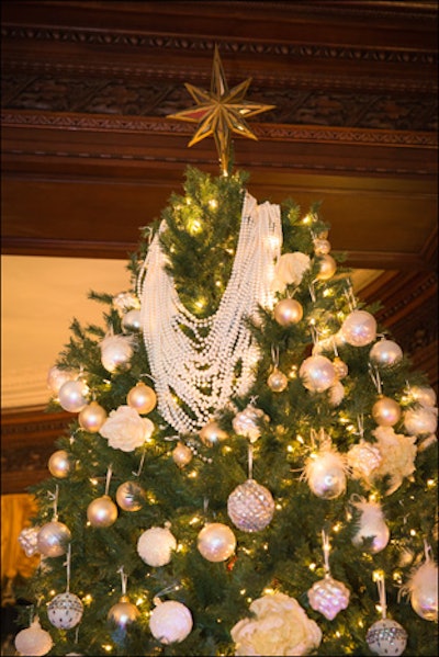 Lynda Reeves, publisher of House and Home, decorated a tree in the spirit of the 1940s. Specifically inspired by a Christian Dior look from that era, Reeves topped her sparkling tree with multiple strands of pearls.