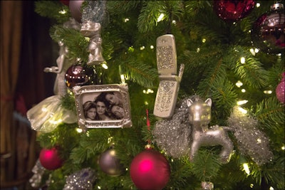 Caspar Haydar Design, a design, production, and event management firm, gave its tree a ''90s glam' theme. Accents included framed photos of the era's iconic supermodels and miniature spray-painted cell phones.