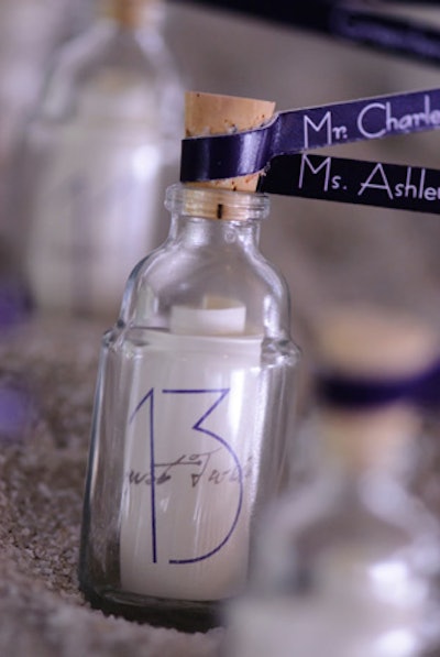 Among the creative place card offerings from Cambridge, Massachusetts-based LoLo Event Design are ones meant to look like messages in a bottle with names on ribbons tied to the corks and numbers inside—suitable for an event with a beach or adventure theme.