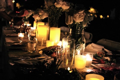 Mason jars as vases and pillar candles created a rustic look at one table.