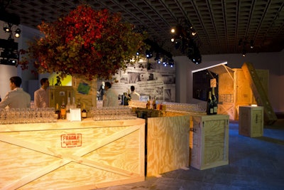 The cocktail and studio party decor included a bar and cocktail tables constructed from repurposed shipping crates—some were authentic crates from the museum, others were newly manufactured for the event.