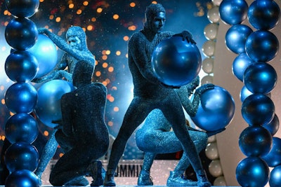 Male dancers sporting glittering silver jumpsuits, sneakers, and face makeup evoked M.A.C. Heirloom Mix glitter powders and the collection’s sparkling product casing.