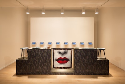 Valentino chose the Whitney Museum of American Art's former Madison Avenue space in which to unveil a special six-piece collection of objects exclusive to the Fifth Avenue flagship, including sunglasses with eyewear case box, scarf, stool, tray, and plate. A row of eight iPads along a back wall offered detailed descriptions of each product, along with additional imagery.