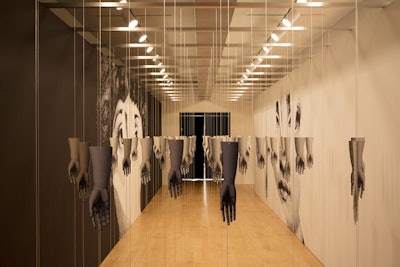 The touch room featured a sectioned-off gallery space bedecked with dozens of hanging Fornasetti arms that guests could weave their way through. Flanked on either side were enlarged Fornasetti face abstracts.