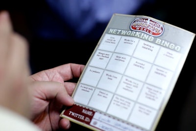 At the opening-night party, organizers helped attendees meet one another by having them play “Networking Bingo.” Guests had to gather Twitter handles of fellow attendees that met the criteria indicated in the 16 boxes on the card.