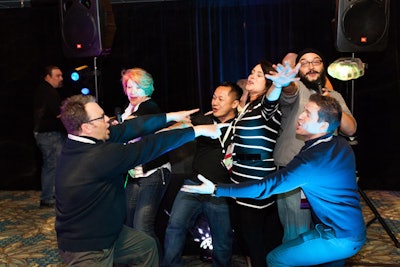 The second night of the conference, guests mingled as they played “social karaoke” while cruising around San Diego Bay aboard a 1,000-person yacht.