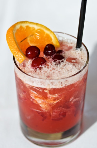 Old-fashioned cocktail with hazelnut-infused bourbon, orange, cinnamon, nutmeg, and cranberries, by Napa Valley Grille in Los Angeles