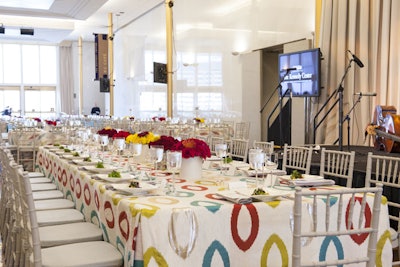 For the luncheon tables, DC Rental provided white linens with colors in complementary shades to those of the event logo.