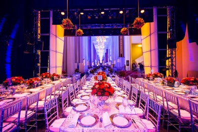 To maximize the seating space on the stages, the event staff used long tables rather than the traditional rounds of 12 used throughout the floor.