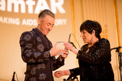 Liza Minnelli presents Alan Cumming with amfAR award of Inspiration in New York